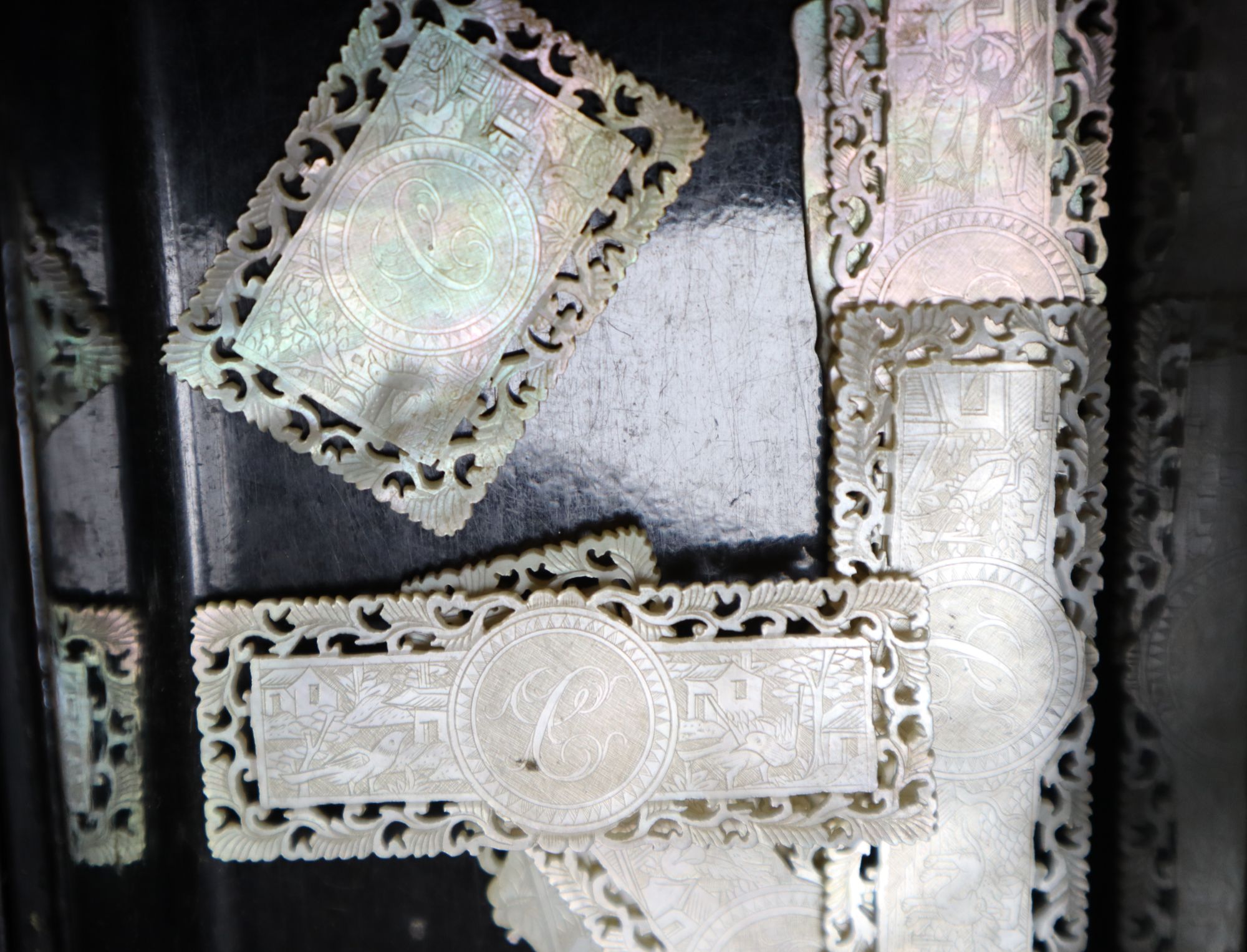 A Jennens and Bettridge papier mache box games box containing a quantity of Chinese mother of pearl counters, length 30cm